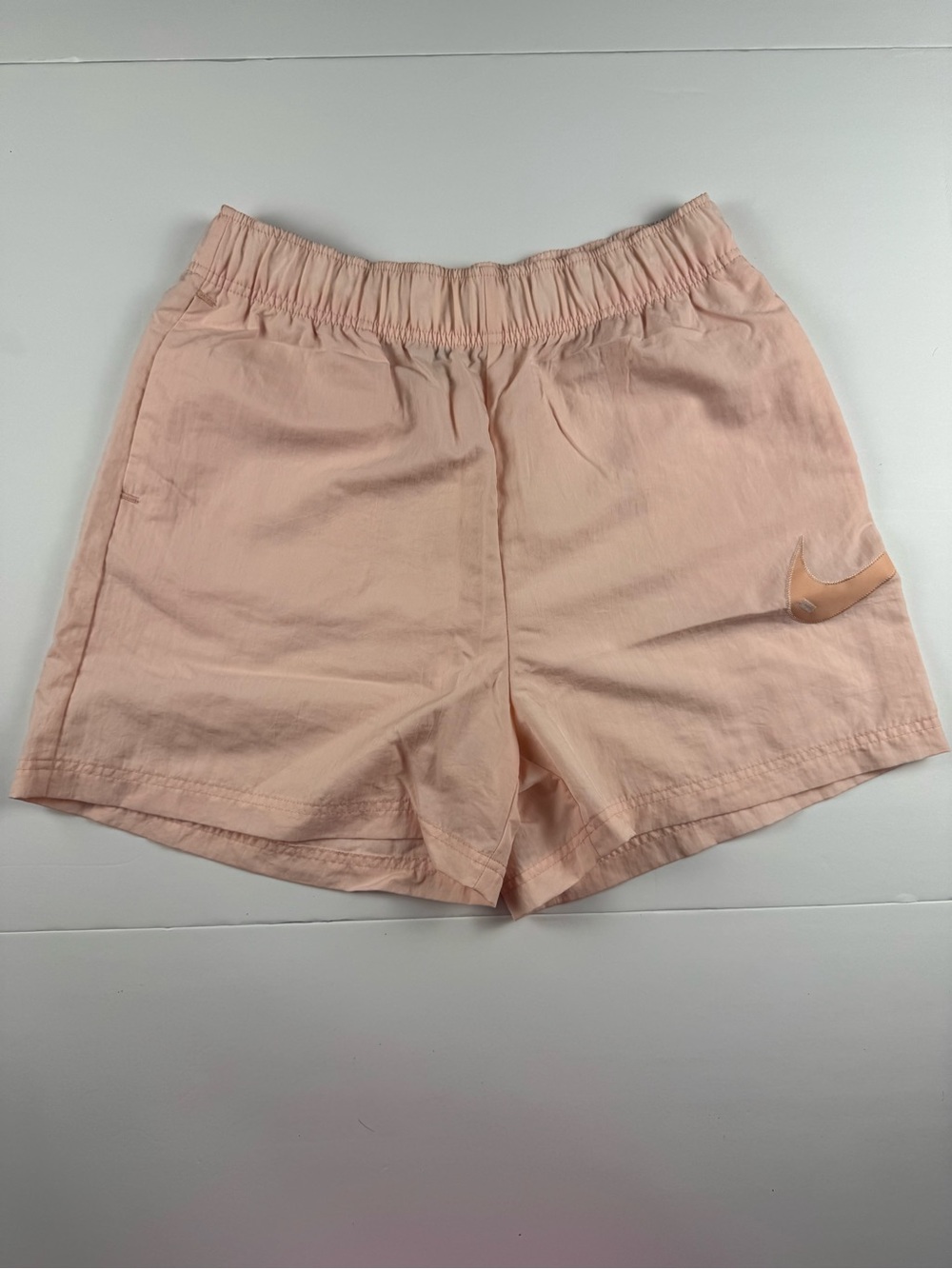 Nike Women's Light Peach Athletic Shorts with Swoosh
